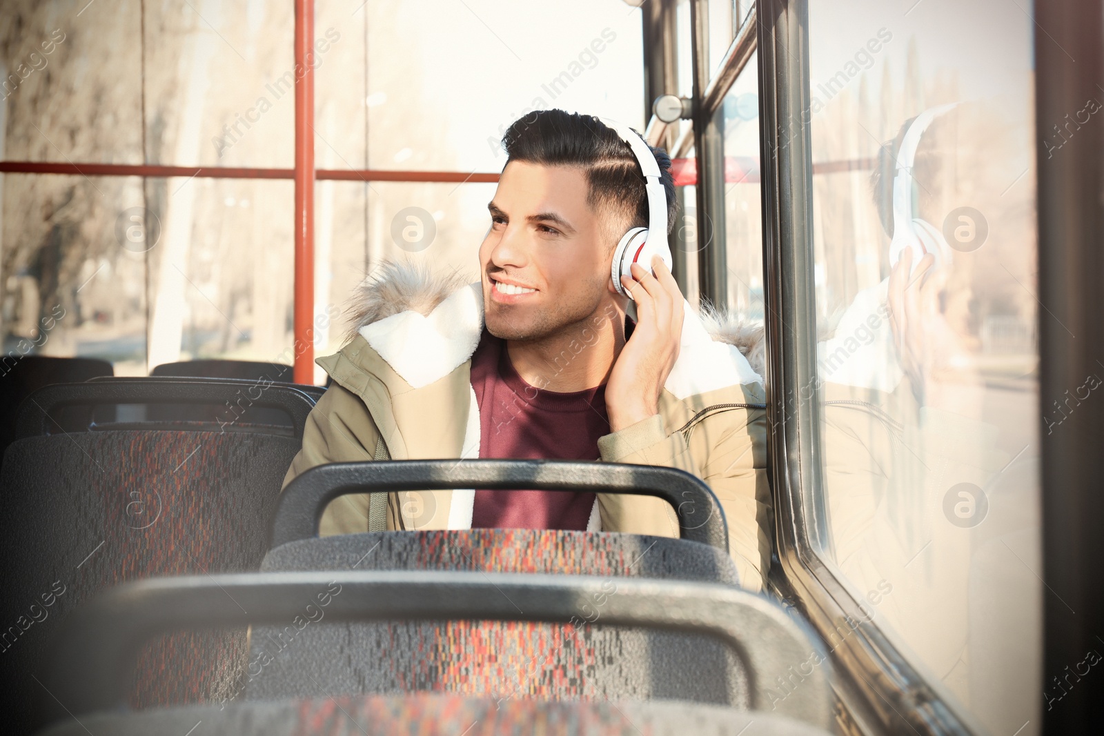 Photo of Man listening to audiobook in trolley bus