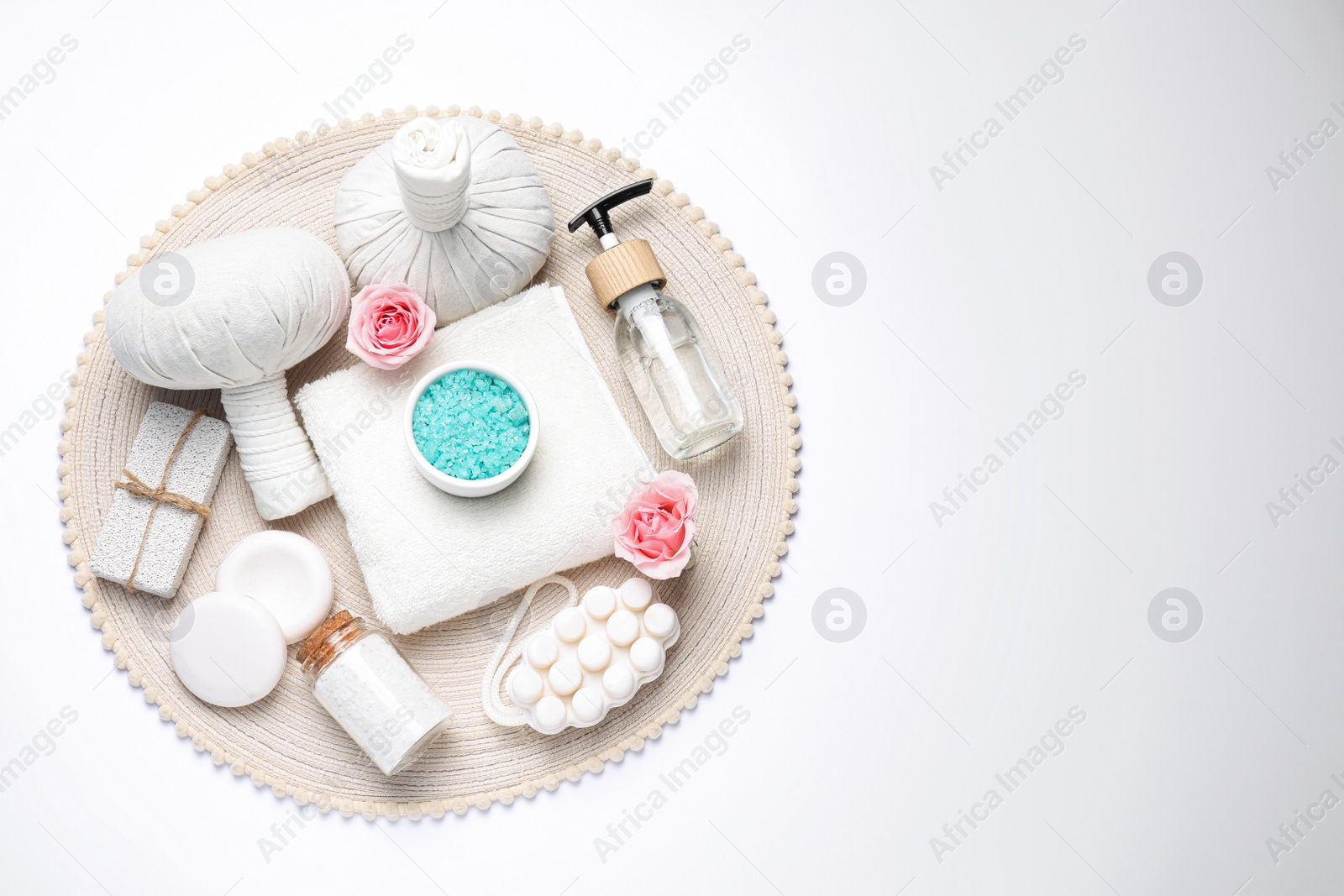 Photo of Beautiful spa composition with herbal massage bags and different care products on white background, top view. Space for text