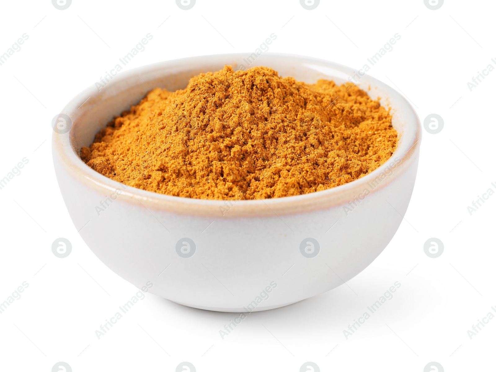 Photo of Curry powder in bowl on white background