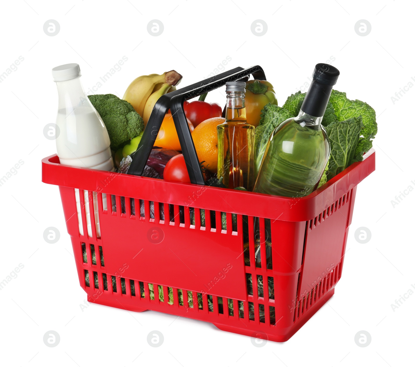 Photo of Shopping basket with grocery products on white background