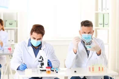 Scientists working in laboratory. Research and analysis