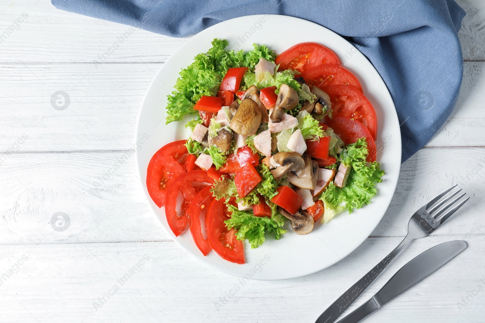 Photo of Plate with delicious fresh salad on table, top view