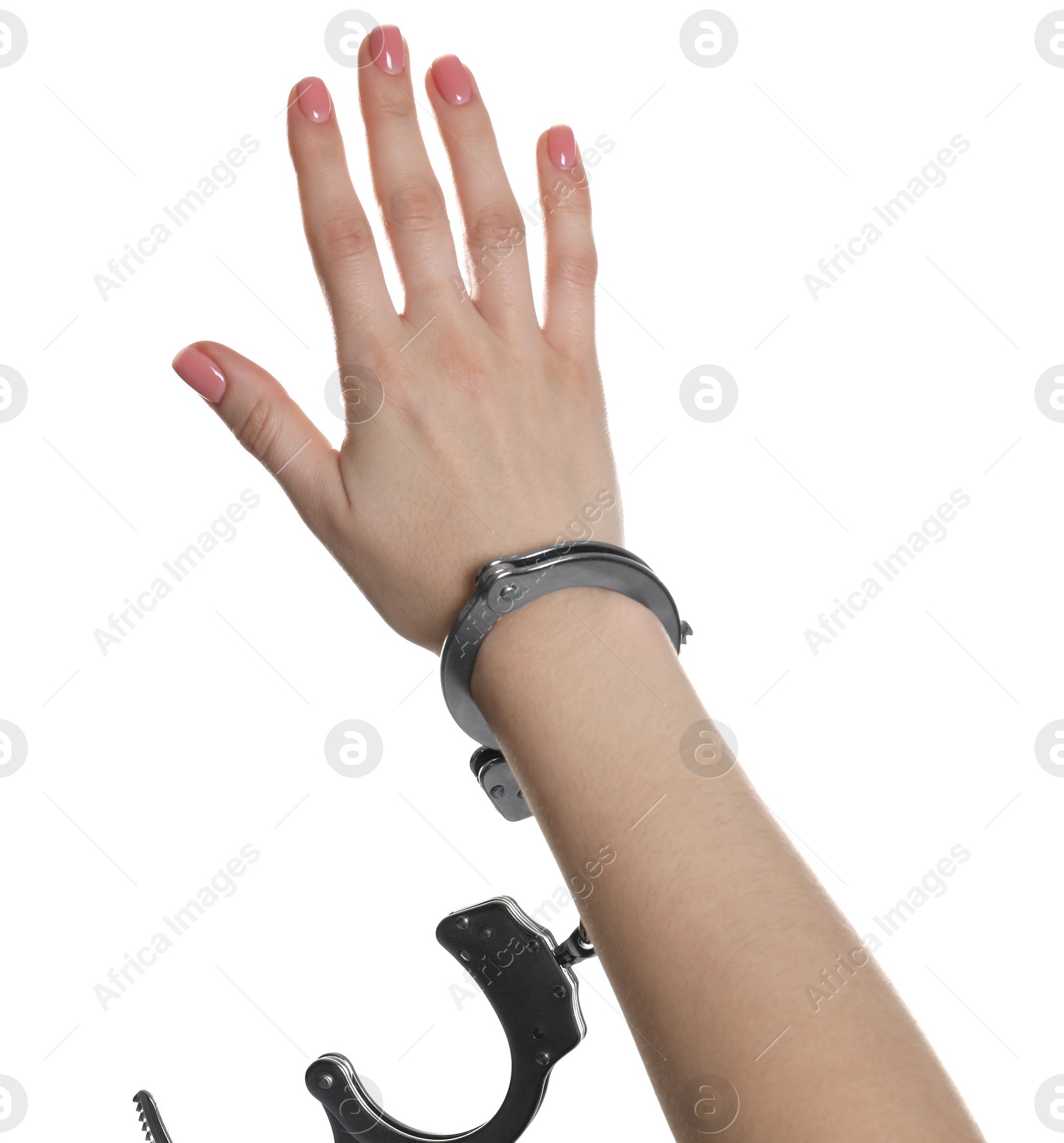 Photo of Freedom concept. Woman with handcuffs on her hand against white background, closeup