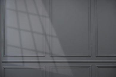 Photo of Shadow from window on grey wall indoors