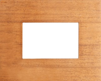 Wooden frame with blank white background. Mockup for design