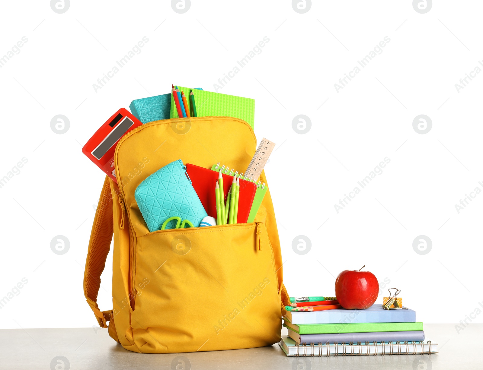 Photo of Color backpack with stationery on white background. Ready for school