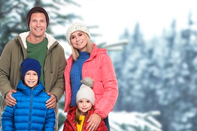 Image of Happy family spending time together near winter forest