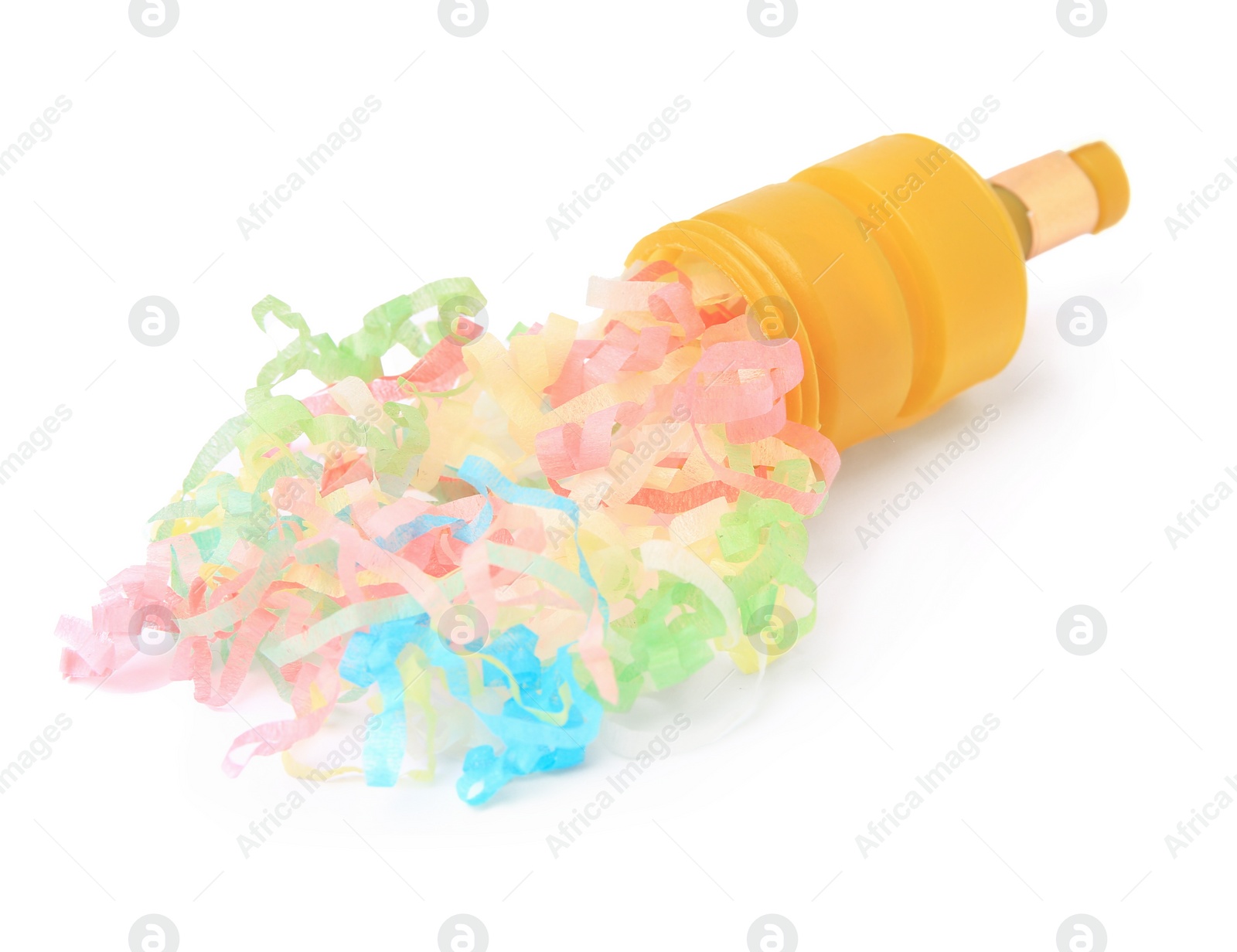 Photo of Colorful streamers with yellow party cracker isolated on white