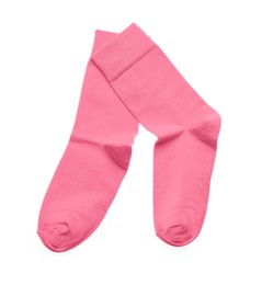 Photo of Pink socks on white background, top view