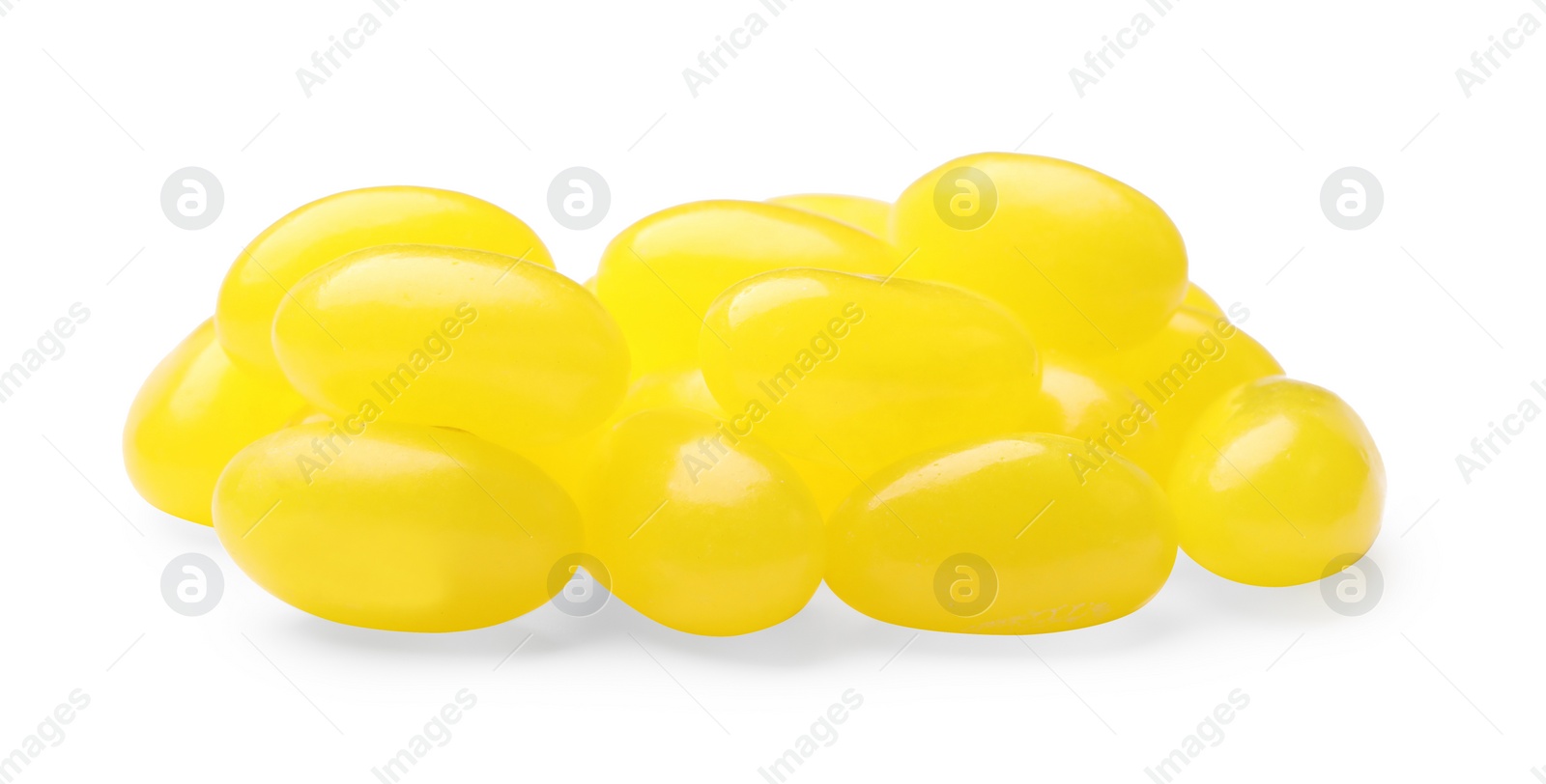 Photo of Tasty small lemon drops isolated on white