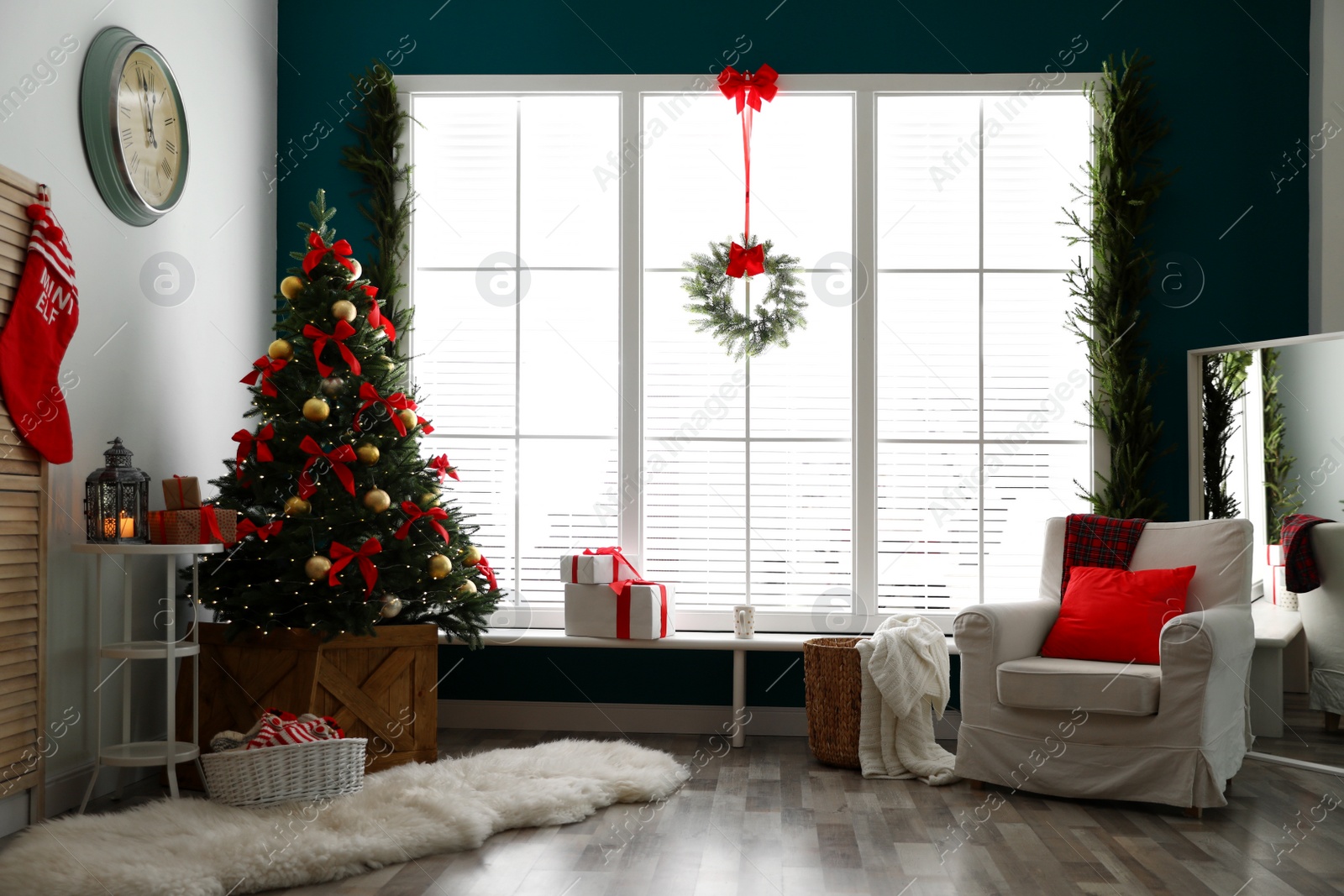 Photo of Stylish room interior with decorated Christmas tree