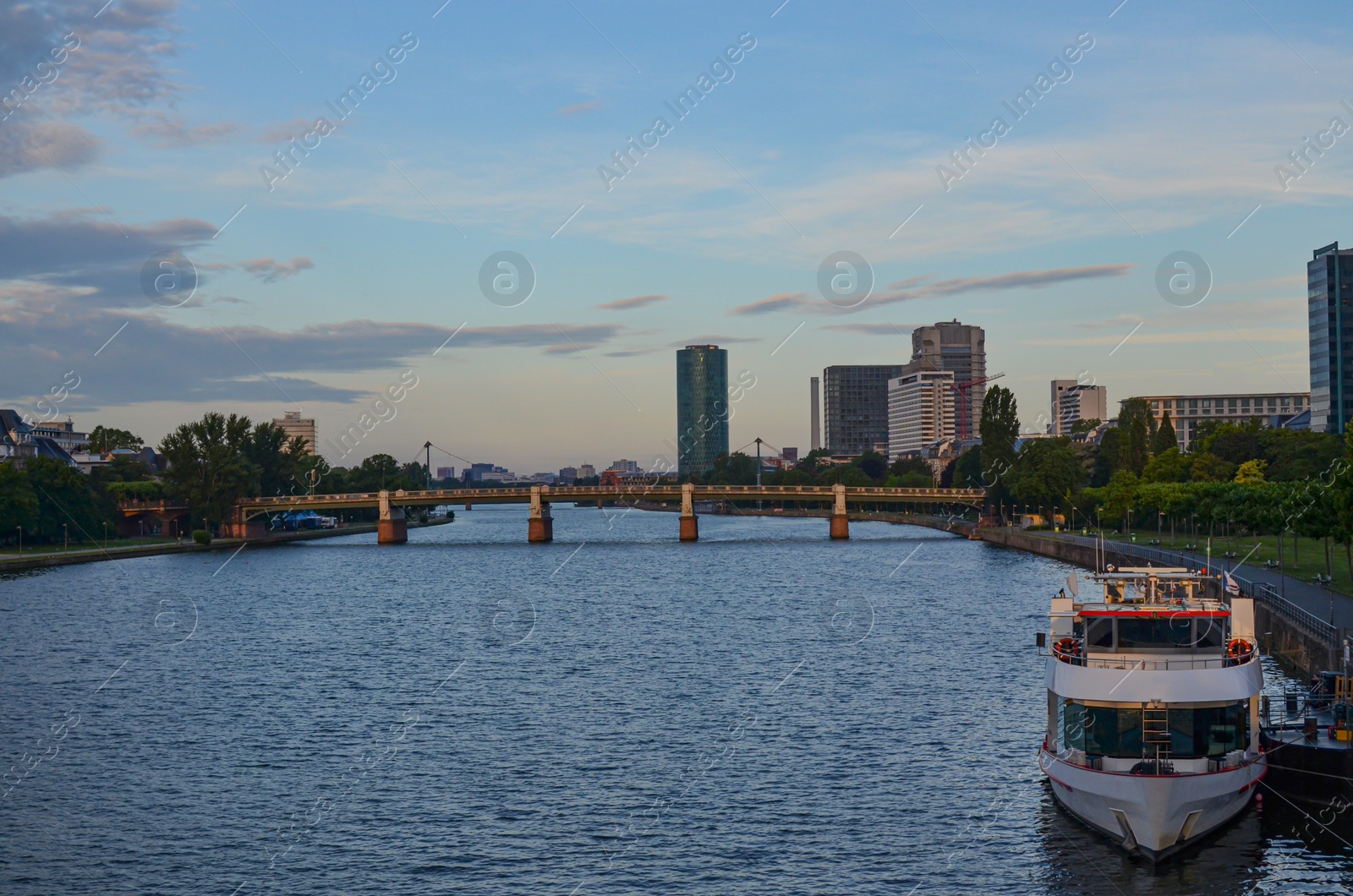 Photo of Beautiful view of cityscape with boat on river