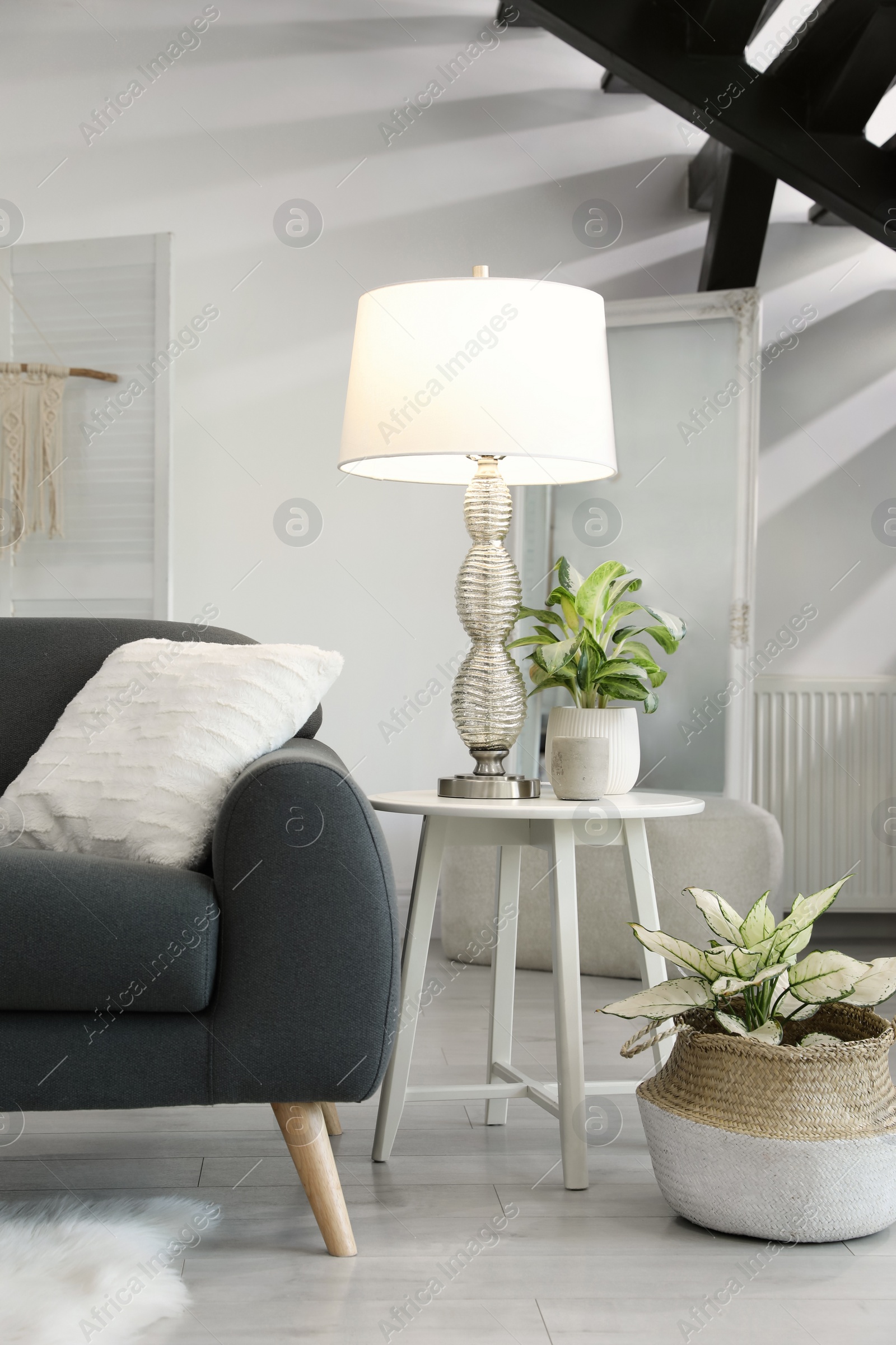 Photo of Living room interior with stylish lamp and comfortable sofa