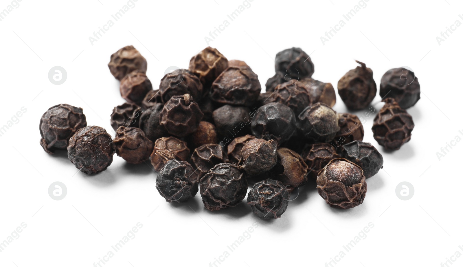 Photo of Aromatic spice. Many black dry peppercorns isolated on white