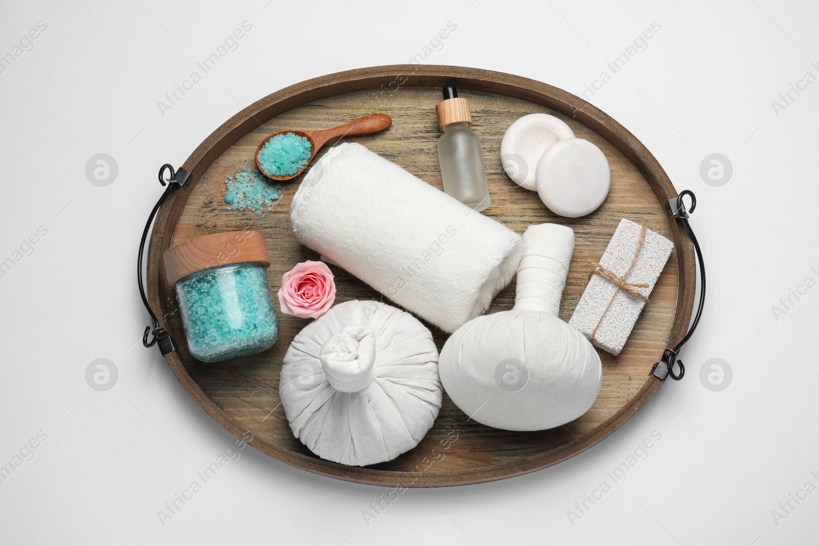 Photo of Beautiful spa composition with herbal massage bags and different care products on white background, top view