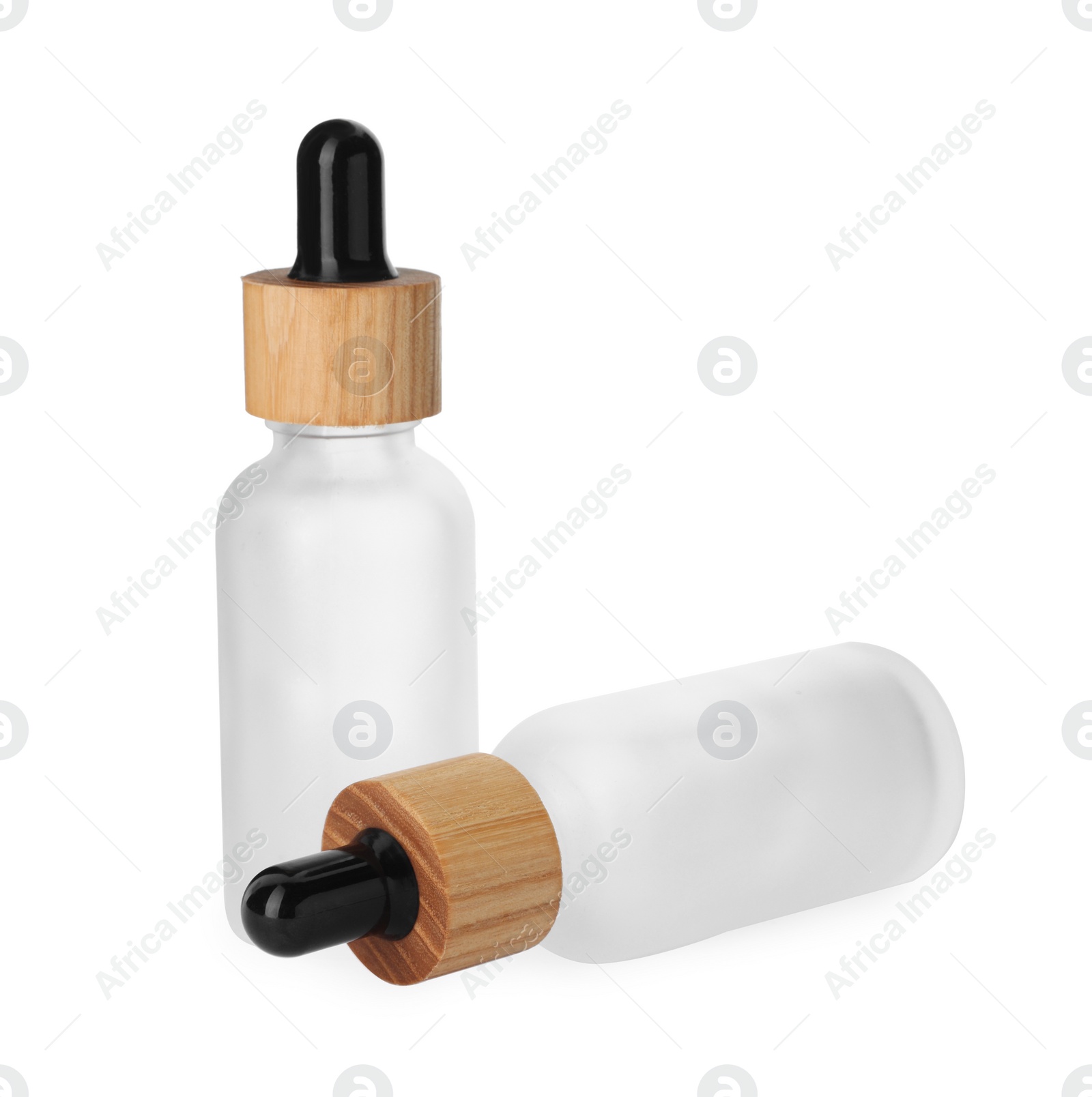 Photo of New empty glass bottles with droppers isolated on white