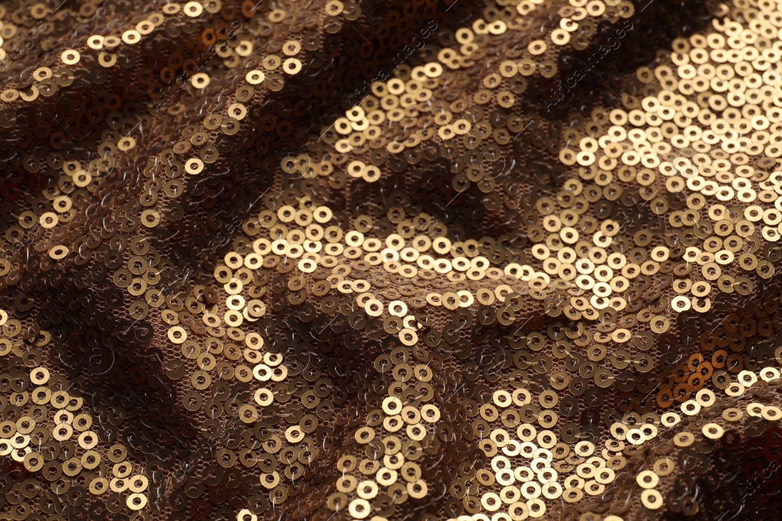 Photo of Beautiful golden sequin fabric as background, closeup