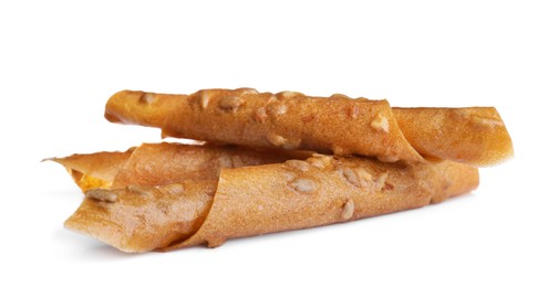 Delicious fruit leather rolls on white background