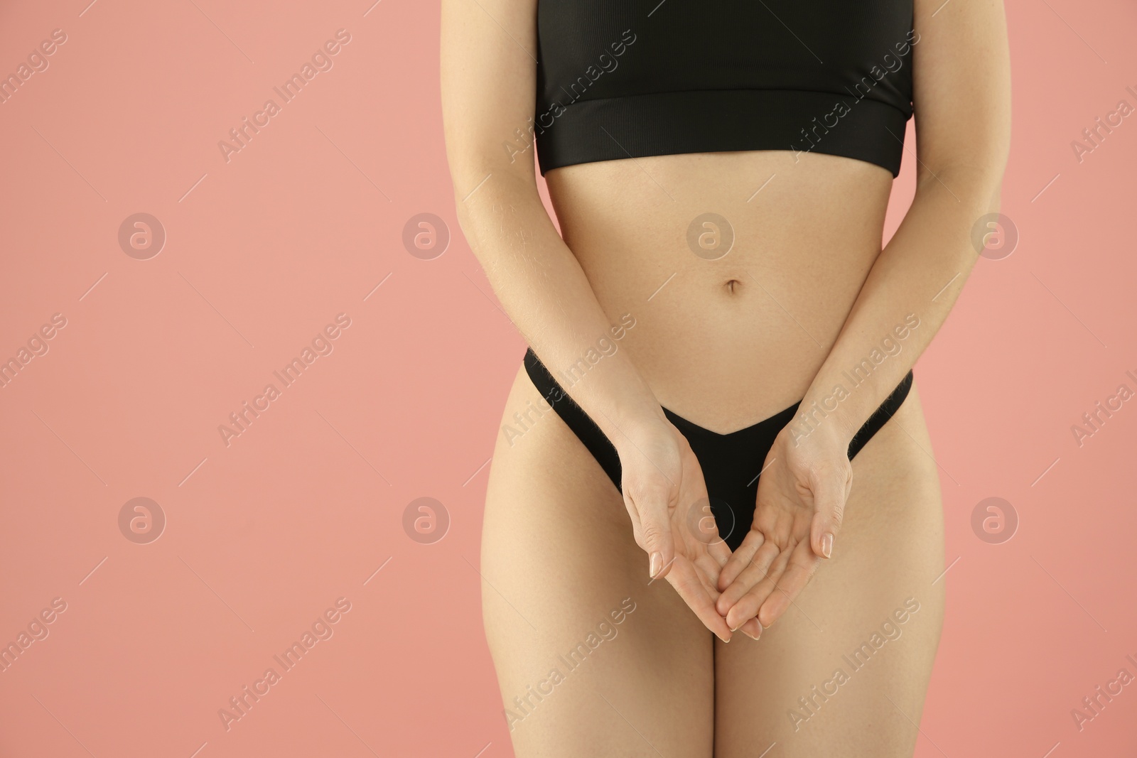 Photo of Gynecology. Woman in underwear on pink background, closeup. Space for text