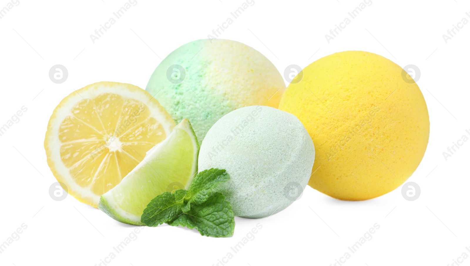 Photo of Citrus bath bombs and fresh fruits with mint on white background