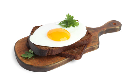 Tasty fried egg with parsley and rye bread isolated on white