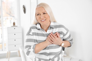 Mature woman having heart attack at home