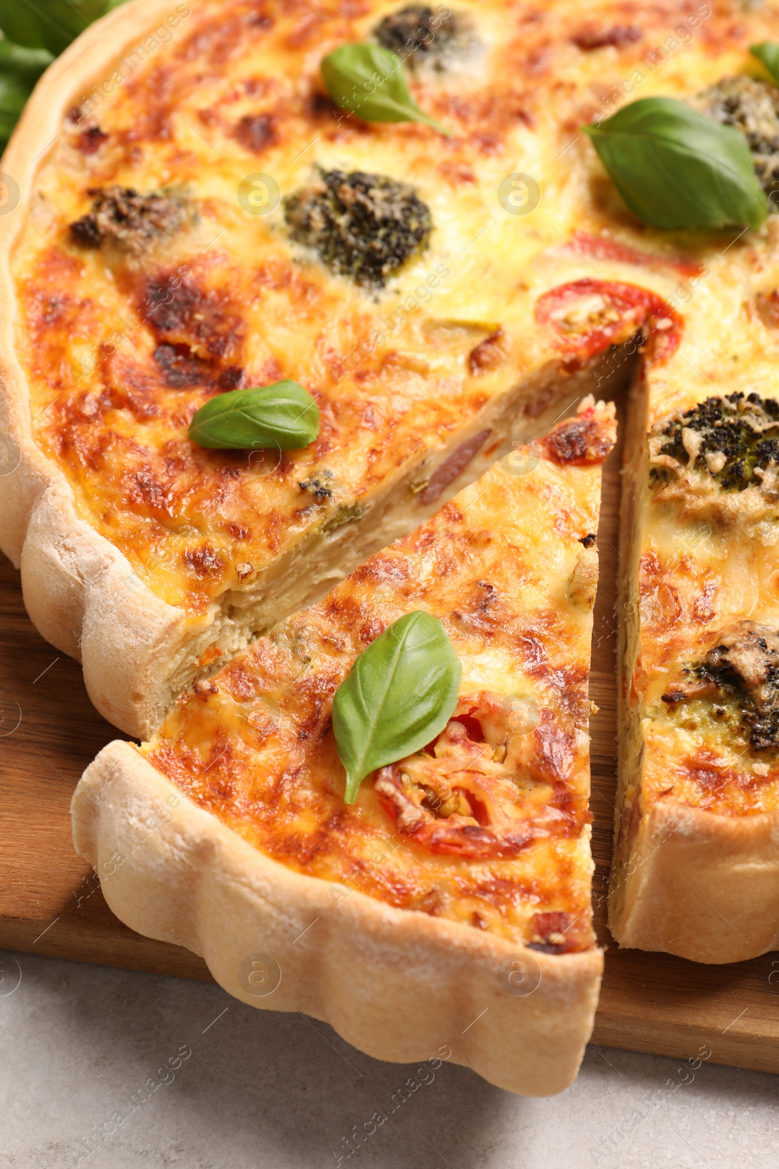 Photo of Delicious homemade vegetable quiche on table, closeup