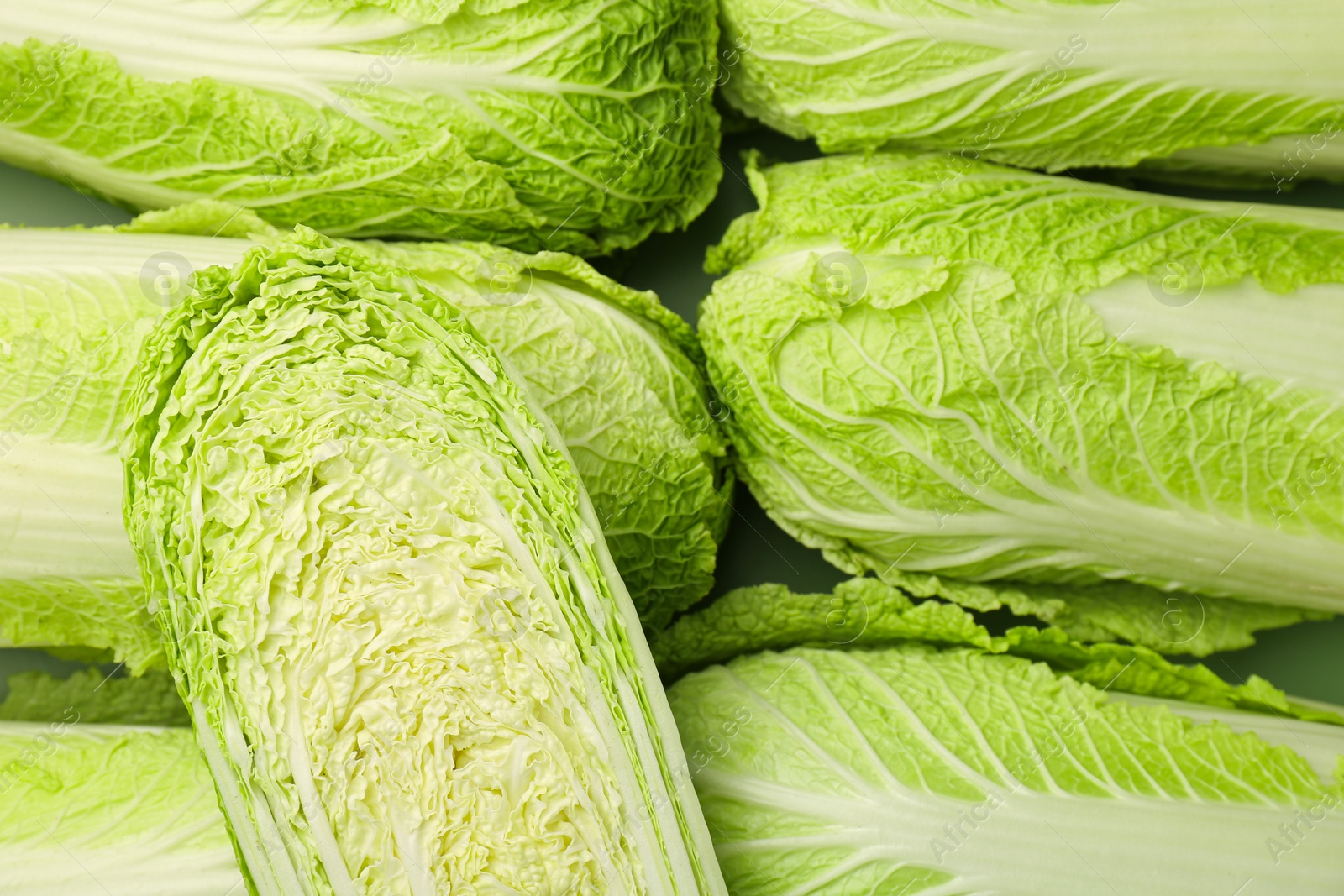 Photo of Fresh ripe Chinese cabbages as background, top view