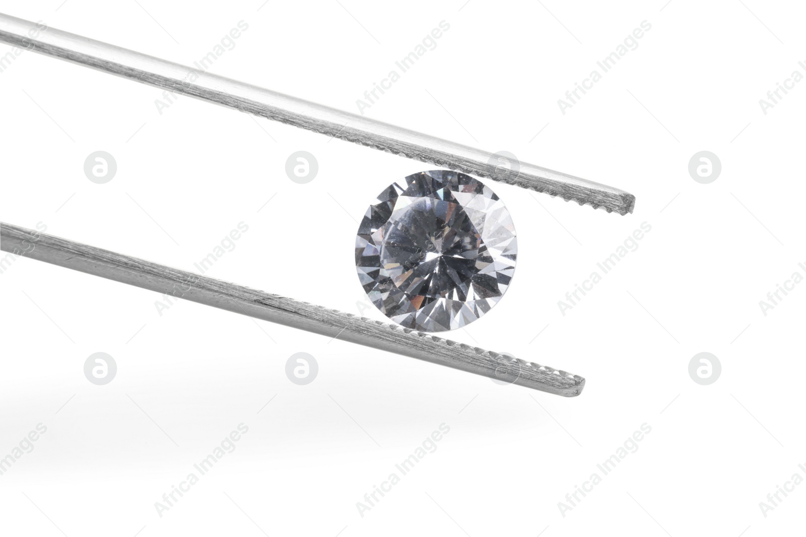 Photo of Tweezers with beautiful shiny diamond isolated on white