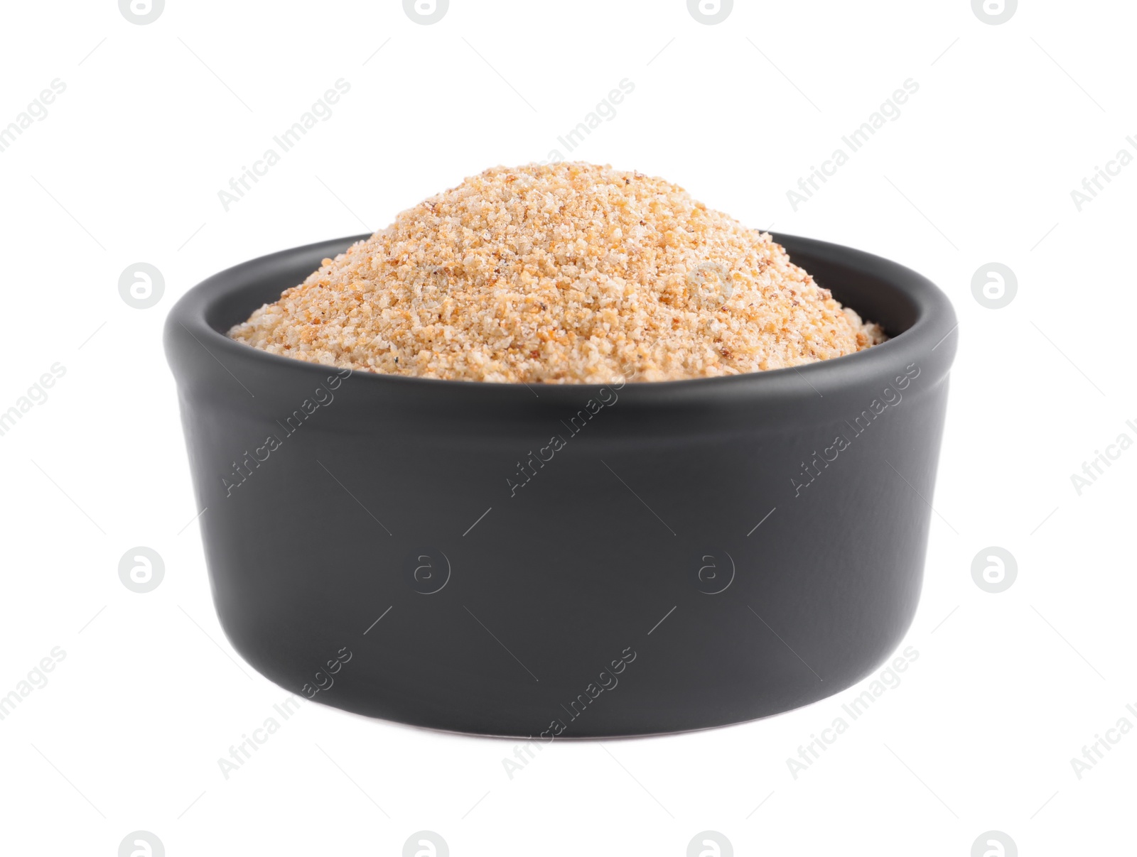 Photo of Fresh bread crumbs in bowl isolated on white