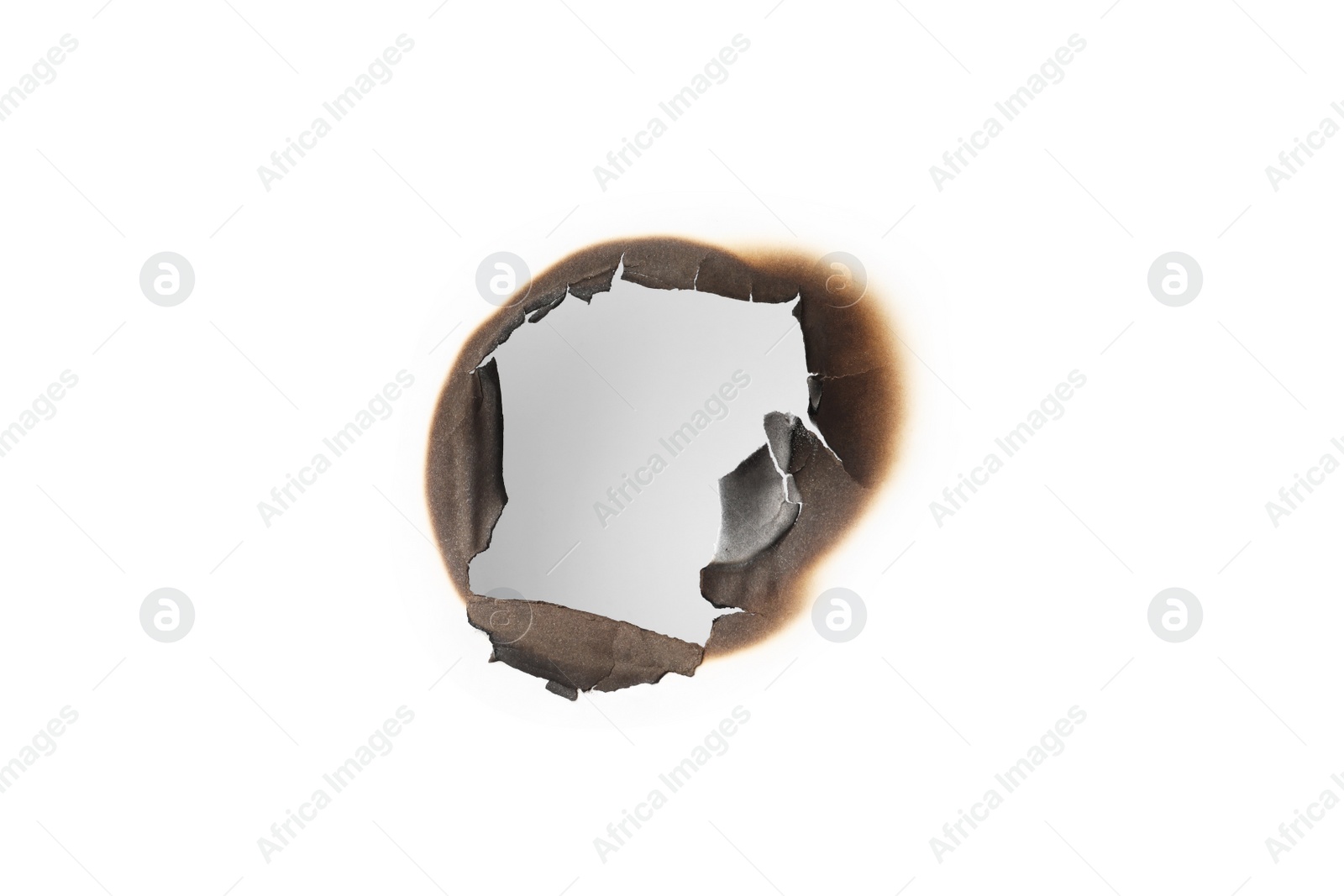 Photo of Burnt hole in paper on white background