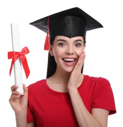 Photo of Emotional student with graduation hat and diploma on white background