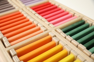Photo of Wooden box with color tablets, closeup. Montessori toy