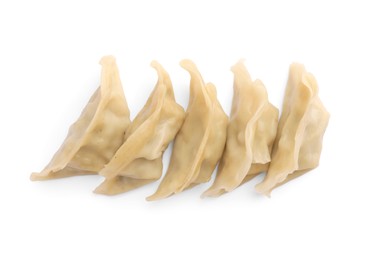 Photo of Delicious gyoza (asian dumplings) isolated on white, top view