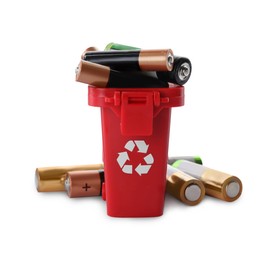 Image of Used batteries in recycling bin on white background