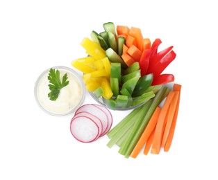 Photo of Different vegetables cut in sticks and bowl with dip sauce on white background, top view