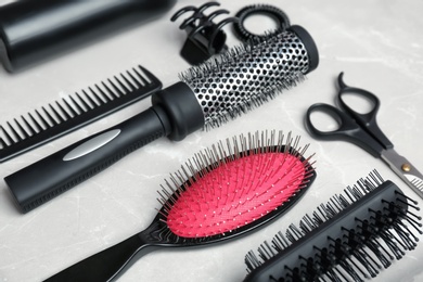 Photo of Professional hairdresser tools on grey background