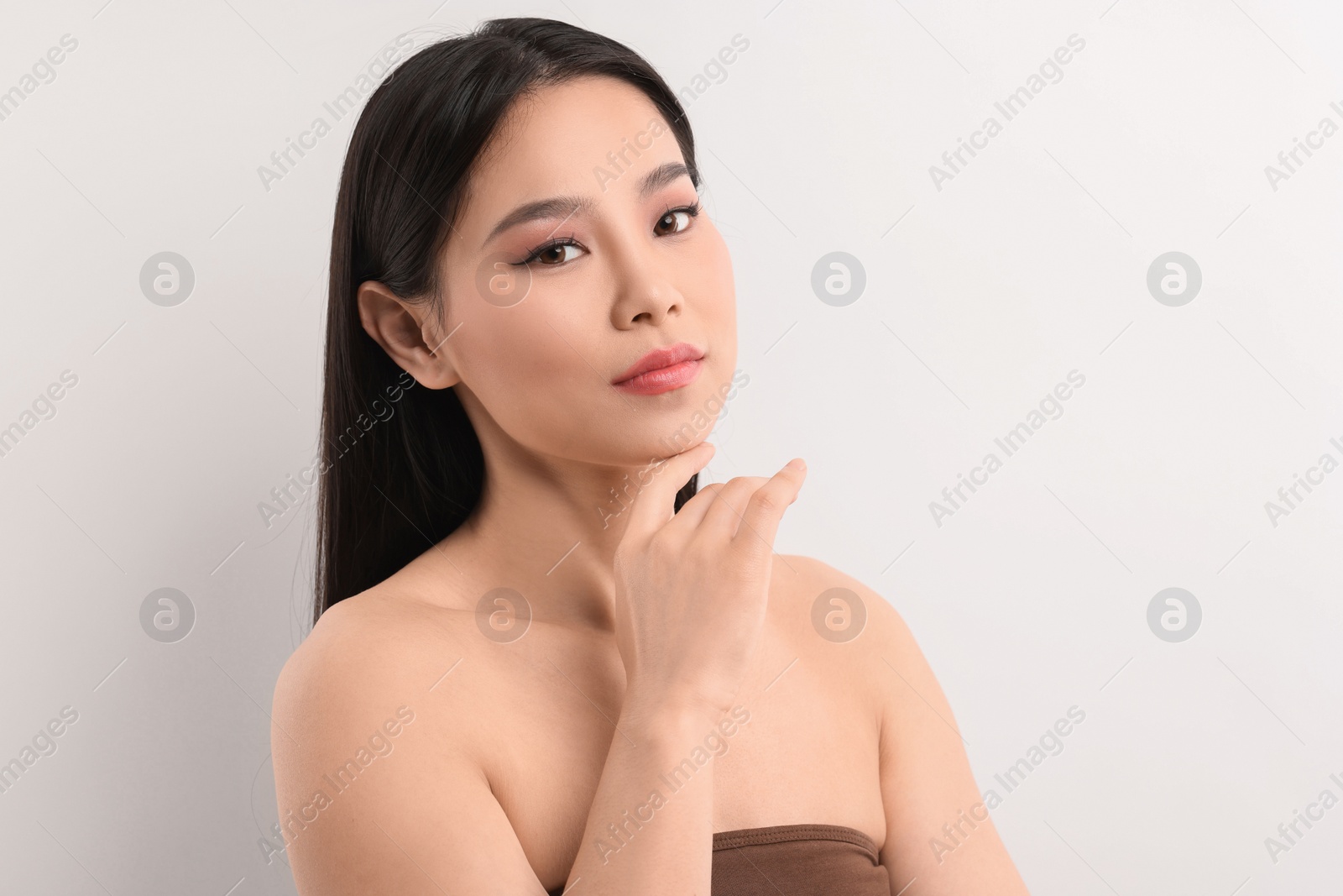 Photo of Portrait of beautiful woman on white background