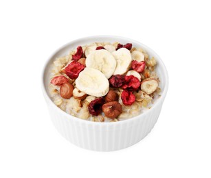 Photo of Delicious oatmeal with freeze dried berries, banana and hazelnuts isolated on white