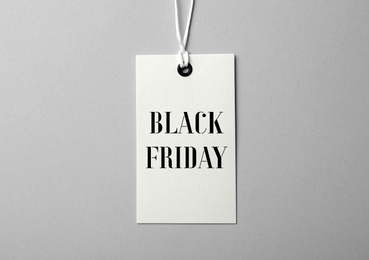 Image of Tag with text BLACK FRIDAY on light background, top view
