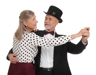 Senior couple dancing together on white background