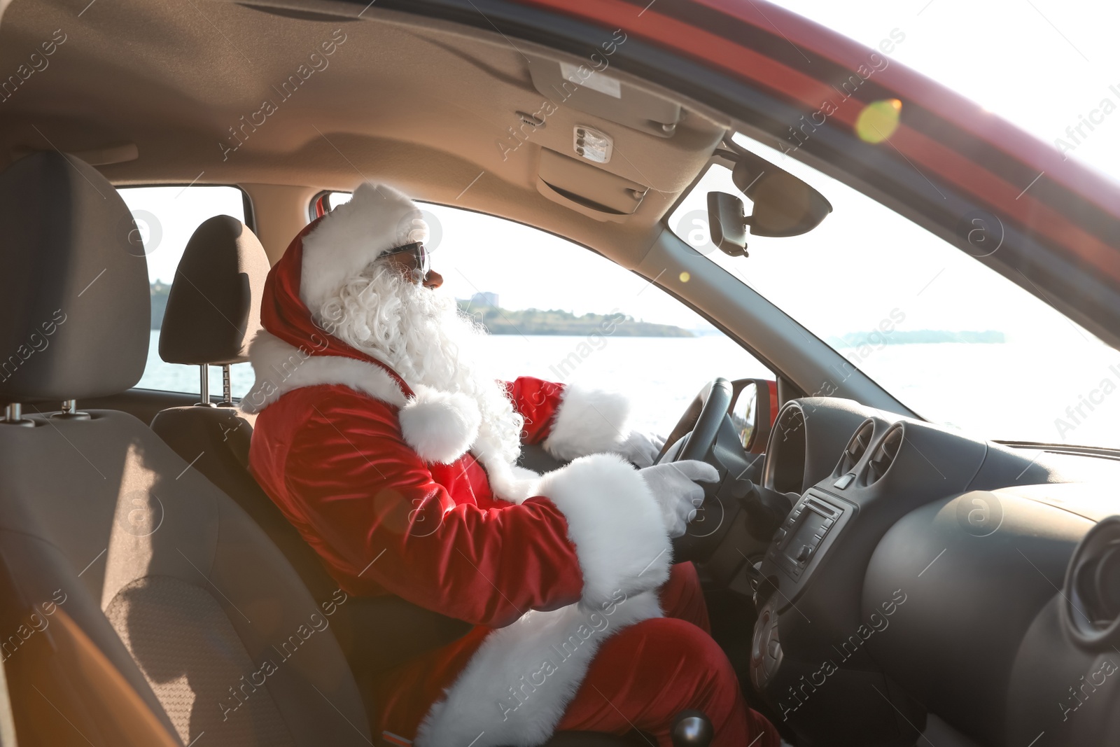 Photo of Authentic Santa Claus driving car, view from inside