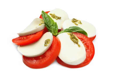 Tasty salad Caprese with mozzarella, tomatoes, basil and pesto sauce isolated on white