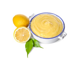 Delicious lemon curd in bowl, fresh citrus fruits and green leaves isolated on white