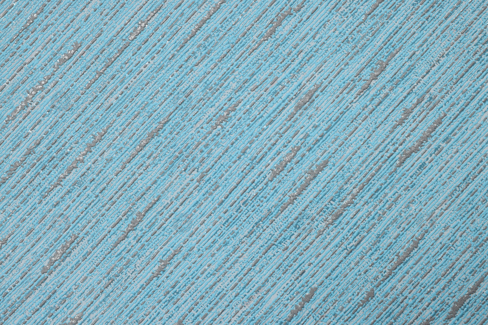 Photo of Stylish light blue wallpaper as background, closeup view