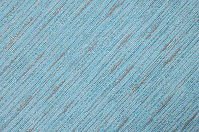 Stylish light blue wallpaper as background, closeup view