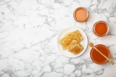 Photo of Flat lay composition with fresh honey on marble background