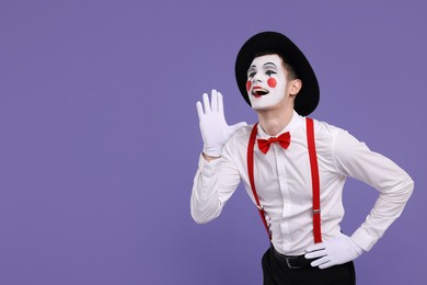 Mime artist screaming on purple background. Space for text