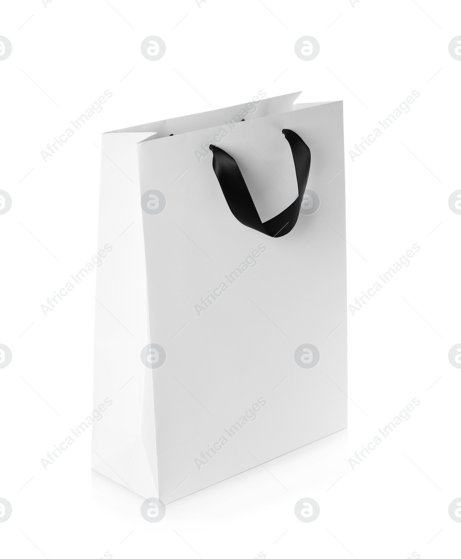 Photo of Paper shopping bag isolated on white. Mock up for design