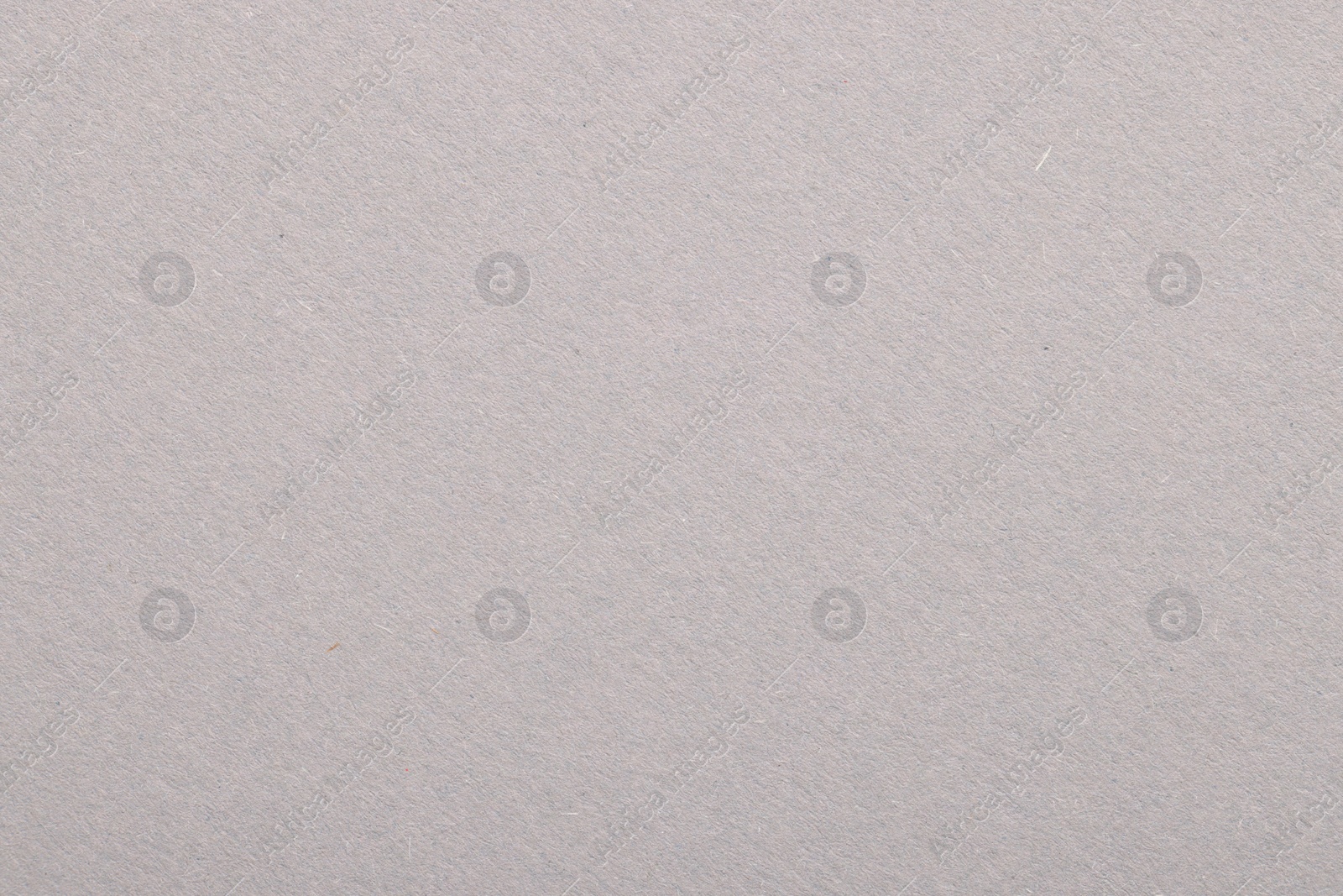 Photo of Texture of light grey paper sheet as background, top view